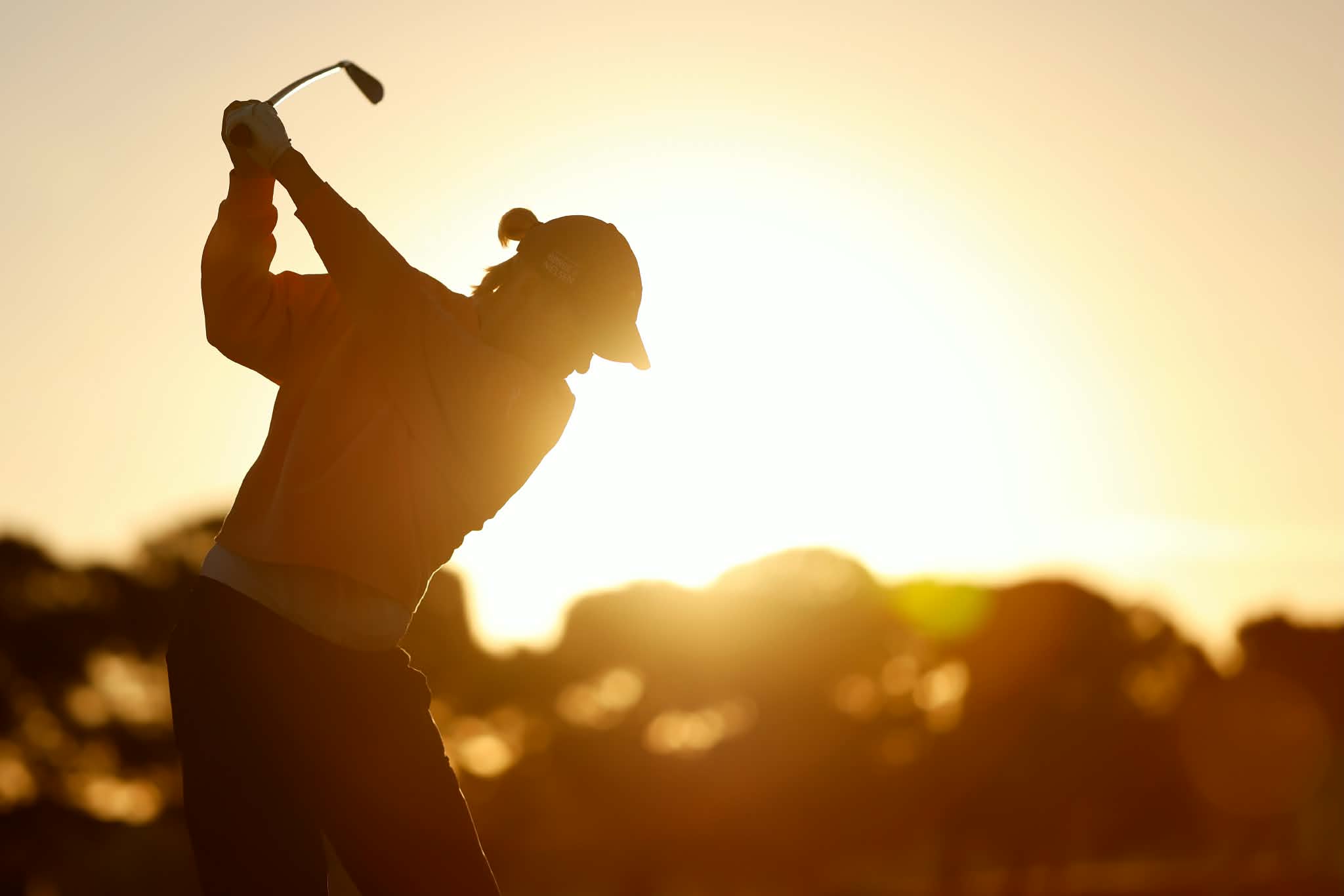 Nicole playing golf